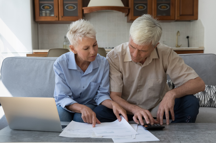 A senior couple researching how long a rollover can take.