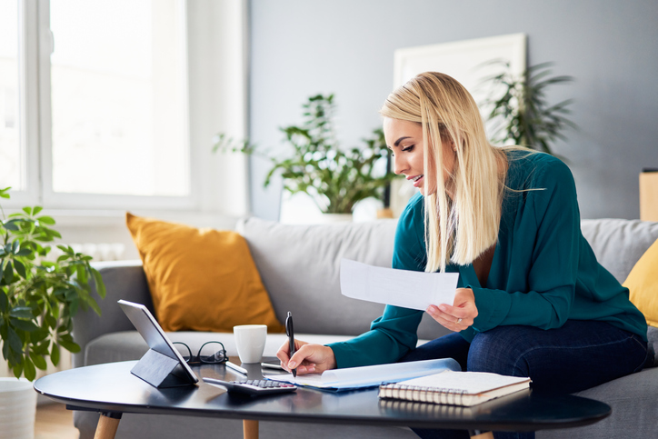 A woman researching tax changes for 2024.