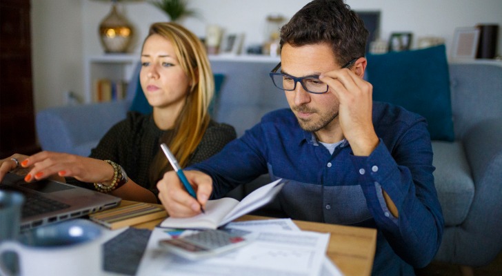 A couple researching how retirement income could benefit their retirement plan.